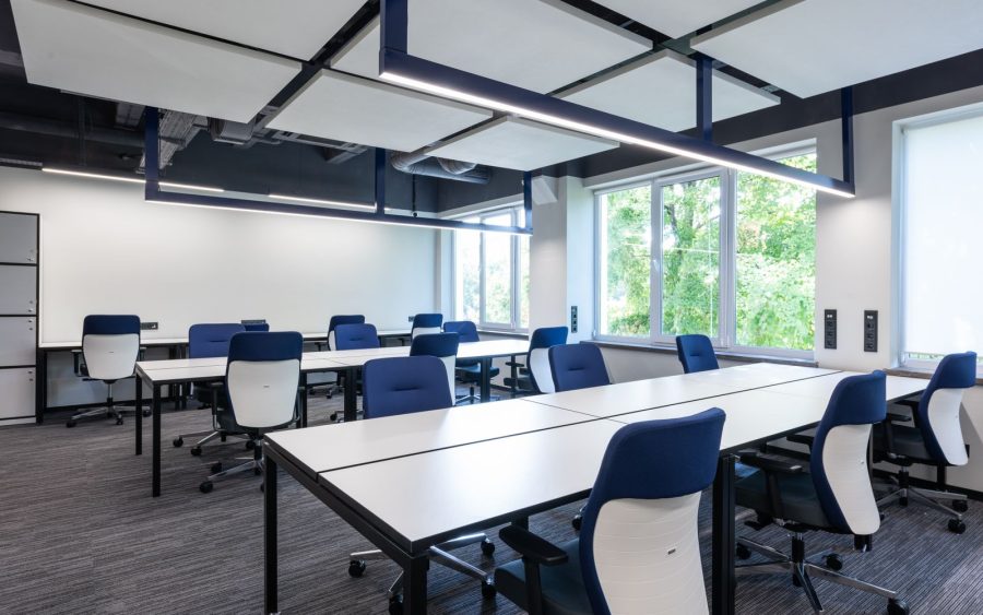 An office of sixty desks, cleaned after seven